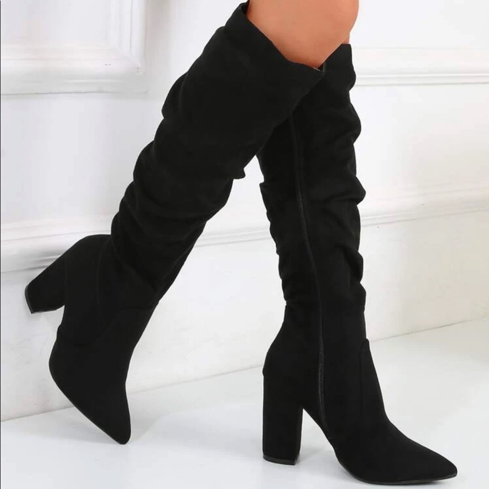 Brand new never worn black slouchy boots. Size:8.5